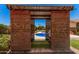 Outdoor poolside bar area featuring custom wooden construction overlooking a pool and well-manicured backyard at 8803 N 105Th Dr, Peoria, AZ 85345