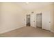 Bedroom featuring an en-suite bathroom and a closet for ample storage space at 9112 E Palm Tree Dr, Scottsdale, AZ 85255