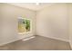 Bright bedroom with a ceiling fan and a large window offering natural light at 9112 E Palm Tree Dr, Scottsdale, AZ 85255