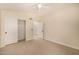 Neutral bedroom featuring carpet floors, a ceiling fan, and a closet at 9112 E Palm Tree Dr, Scottsdale, AZ 85255