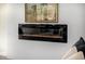 Electric fireplace with horse painting hanging above at 9112 E Palm Tree Dr, Scottsdale, AZ 85255