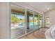 Living room sliding glass doors open to a beautiful pool and patio area at 9112 E Palm Tree Dr, Scottsdale, AZ 85255