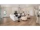 Open living room featuring a fireplace, lots of natural light, and seamlessly integrates the kitchen and dining areas at 9112 E Palm Tree Dr, Scottsdale, AZ 85255