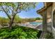 A stunning backyard oasis with a sparkling pool, lush green lawn, and mountain views at 9112 E Palm Tree Dr, Scottsdale, AZ 85255