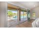 Living room sliding glass doors open to a beautiful pool and patio area at 9112 E Palm Tree Dr, Scottsdale, AZ 85255