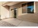 Covered back patio with brick pavers, sliding glass doors, and window at 9350 W Williams St, Tolleson, AZ 85353
