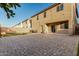 Spacious backyard featuring artificial grass, brick pavers, and string lights at 9350 W Williams St, Tolleson, AZ 85353