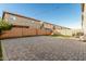 Spacious backyard featuring artificial grass, brick pavers, and string lights at 9350 W Williams St, Tolleson, AZ 85353