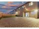 Backyard featuring a brick patio and a small patch of artificial turf at 9350 W Williams St, Tolleson, AZ 85353