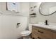 Stylish bathroom featuring a modern vanity, round mirror, and decorative accents at 9350 W Williams St, Tolleson, AZ 85353
