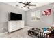 Bedroom featuring tile flooring, ceiling fan and a window providing natural light at 9350 W Williams St, Tolleson, AZ 85353