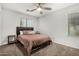 Bedroom featuring carpet flooring, ceiling fan and a window providing natural light at 9350 W Williams St, Tolleson, AZ 85353