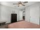 Bedroom featuring carpet flooring, ceiling fan and a closet with white doors at 9350 W Williams St, Tolleson, AZ 85353