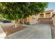 Attractive home featuring a two-car garage, a balcony, and mature landscaping at 9350 W Williams St, Tolleson, AZ 85353