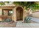 Inviting front entrance featuring desert landscaping and a covered entryway with an arched doorway at 9350 W Williams St, Tolleson, AZ 85353