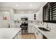 Modern kitchen featuring white cabinets, stainless steel appliances, subway tile backsplash, and quartz countertops at 9350 W Williams St, Tolleson, AZ 85353