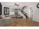 Inviting living room featuring tile floors, a ceiling fan, and staircase at 9350 W Williams St, Tolleson, AZ 85353