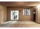 Covered patio with sliding glass door leading inside, and an adjacent window at 9350 W Williams St, Tolleson, AZ 85353