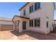 Back exterior featuring a covered patio, and a dirt filled yard at 9412 E Sequence Ave, Mesa, AZ 85212
