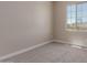 This bedroom features a cozy carpet and a bright window view at 9412 E Sequence Ave, Mesa, AZ 85212