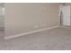 Carpeted bedroom with light walls, baseboard trim and electrical outlets at 9412 E Sequence Ave, Mesa, AZ 85212