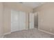 Carpeted bedroom with light walls and closet with sliding doors at 9412 E Sequence Ave, Mesa, AZ 85212