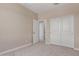 Bedroom featuring neutral walls, carpet and a large closet with sliding doors at 9412 E Sequence Ave, Mesa, AZ 85212