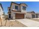 Charming two-story home with a two-car garage, brown trim, and desert landscaping at 9412 E Sequence Ave, Mesa, AZ 85212