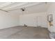 Spacious garage with concrete floors, water heater and ample room for storage at 9412 E Sequence Ave, Mesa, AZ 85212