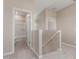 Hallway with carpet, white trim, and an open bathroom at 9412 E Sequence Ave, Mesa, AZ 85212