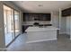 Beautiful kitchen featuring stainless steel appliances, an island, and dark cabinetry at 9412 E Sequence Ave, Mesa, AZ 85212