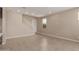Open-concept living room with tile floors, a staircase, and a view of the yard at 9412 E Sequence Ave, Mesa, AZ 85212