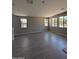 Open living area featuring tile flooring and plenty of natural light from large windows at 9412 E Sequence Ave, Mesa, AZ 85212