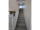 Bright staircase leading to the upper level of the home with a view into the kitchen at 9412 E Sequence Ave, Mesa, AZ 85212