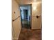 Well-lit hallway with handrails providing access to different parts of the home at 10307 W Oakmont Dr, Sun City, AZ 85351