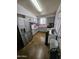Traditional kitchen equipped with stainless steel appliances and white cabinetry at 10307 W Oakmont Dr, Sun City, AZ 85351