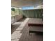 Relaxing covered patio featuring brick pavers, a grill, and a nice outdoor table at 10307 W Oakmont Dr, Sun City, AZ 85351