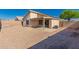 Backyard featuring gravel landscape, block walls, and covered patio at 10956 E Delta Ave, Mesa, AZ 85208
