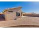 Backyard featuring low maintenance landscaping and partial view of the covered patio at 10956 E Delta Ave, Mesa, AZ 85208