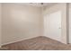 Bedroom featuring neutral walls, carpet flooring, and a large closet at 10956 E Delta Ave, Mesa, AZ 85208