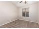 Bright bedroom with a ceiling fan and window offering natural light at 10956 E Delta Ave, Mesa, AZ 85208