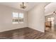 Open dining space with wood floors, natural light, and views into the kitchen at 10956 E Delta Ave, Mesa, AZ 85208