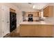 Bright kitchen features wood cabinets, laminate countertops, and stainless steel appliances at 10956 E Delta Ave, Mesa, AZ 85208