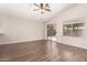 Inviting living area showcasing wood-look floors and sliding glass door to the backyard at 10956 E Delta Ave, Mesa, AZ 85208