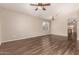 Open-concept living space with wood flooring, ceiling fan, and chandelier at 10956 E Delta Ave, Mesa, AZ 85208