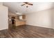 Living room showing open layout with wood floors and the view into the kitchen at 10956 E Delta Ave, Mesa, AZ 85208