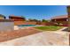 Enjoy a private pool and patio in this landscaped backyard oasis with red rock features and clear blue skies at 11836 W Planada Ct, Sun City, AZ 85373