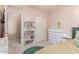 Bedroom featuring carpet, sliding-door closet, and dresser at 11836 W Planada Ct, Sun City, AZ 85373