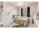 Bedroom with ceiling fan, window with blinds, carpet, and white dresser at 11836 W Planada Ct, Sun City, AZ 85373