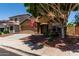 Charming two-story home featuring a well-manicured front yard and a two-car garage at 11836 W Planada Ct, Sun City, AZ 85373